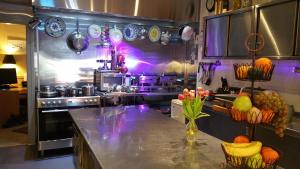a kitchen with a counter with fruits and vegetables at Westholme Hotel in Blackpool