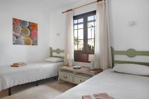 Łóżko lub łóżka w pokoju w obiekcie Puerto Chico 3