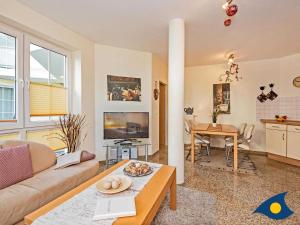 TV a/nebo společenská místnost v ubytování Dünen-Residenz C 08