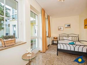 Postel nebo postele na pokoji v ubytování Dünen-Residenz C 08