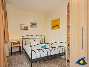 Postel nebo postele na pokoji v ubytování Dünen-Residenz C 08