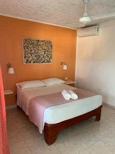 Postel nebo postele na pokoji v ubytování Hotel Pedernales Italia Republica Dominicana