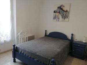 Posteľ alebo postele v izbe v ubytovaní Appartement Le Cernuschi 2C