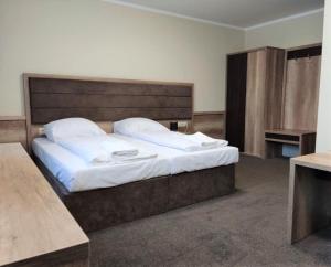 Posteľ alebo postele v izbe v ubytovaní Hotel Cargo