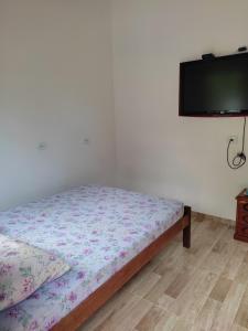 Säng eller sängar i ett rum på Pousada Sossego da Vila - Trindade Paraty