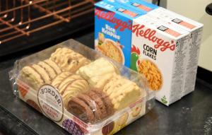 a plastic container of pastries and a box of cereal at 13 Matheson Place in Portree