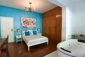 A bed or beds in a room at Rio Boutique Suites