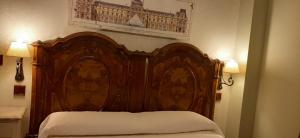 Ένα ή περισσότερα κρεβάτια σε δωμάτιο στο APARTAMENTOS TURÍSTICOS Y SUITES