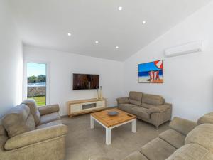 A television and/or entertainment centre at Villa Son Blanc Grupo Seranova Luxury Hotel