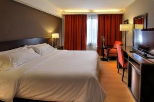 Postel nebo postele na pokoji v ubytování Hotel Crans Montana