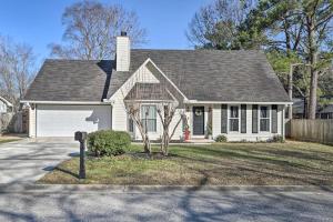 a house with a parking meter in front of it at Fire Pit, Gazebo and Hot Tub North Charleston Home! in Charleston