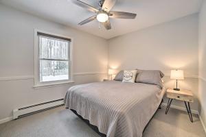 a bedroom with a bed and a ceiling fan at Harbor Springs Rental Home Swim and Boat Nearby! in Harbor Springs