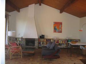 a living room with a couch and a fireplace at Villa Les Quatre Vents mit traumhaftem Meerblick in Hyères