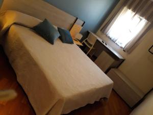 Postel nebo postele na pokoji v ubytování Hotel Ottagono