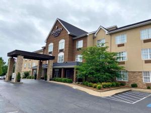 a rendering of a hotel with a parking lot at Country Inn & Suites by Radisson, Jackson, TN in Jackson