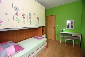 Postel nebo postele na pokoji v ubytování Apartman Diana
