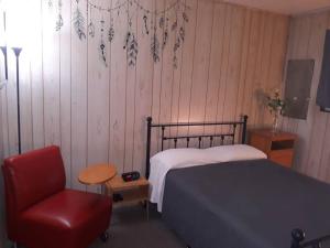 Säng eller sängar i ett rum på Clubhouse Lakeview Chalet