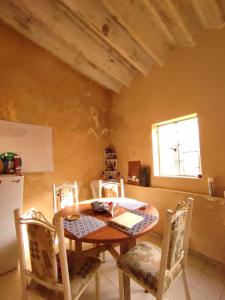 a dining room with a table and chairs and a window at VAMO A ROLA in Campeche +27 photos