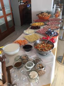 a table filled with lots of different types of food at Hotel Royal in Giulianova