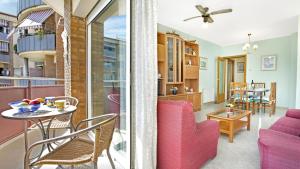 ein Wohnzimmer mit einem rosa Sofa und einem Tisch in der Unterkunft 2 Ross - Lloret de Mar in Lloret de Mar