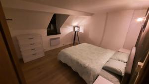Cama ou camas em um quarto em Gîte La Houblonnière