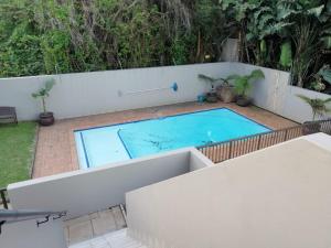 a swimming pool in the backyard of a house at Beachfront - 34 Blue Largo in Westbrook