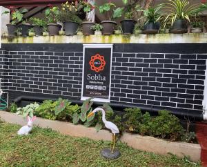 Certificato, attestato, insegna o altro documento esposto da Sobha Holiday Home