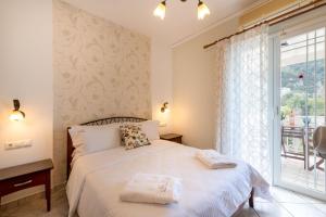 
Ένα ή περισσότερα κρεβάτια σε δωμάτιο στο Sea Breeze Hotel & Apartments
