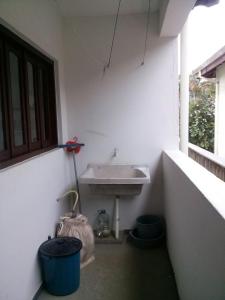 a bathroom with a sink next to a window at Excellence Apart in Ubatuba