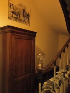 a room with a staircase and a wooden stair case at Helocar in Morlaix