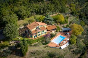 an aerial view of a house with a swimming pool at Villa Liana in Vinci