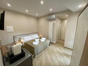 Кровать или кровати в номере ESPERIA B&B
