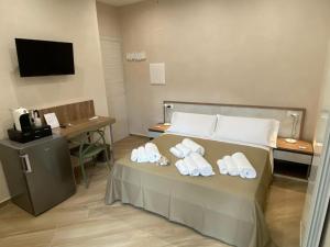 Кровать или кровати в номере ESPERIA B&B