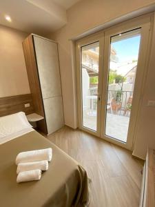 Кровать или кровати в номере ESPERIA B&B