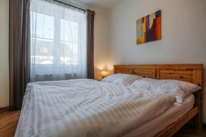 Postel nebo postele na pokoji v ubytování Apartmán Géčko