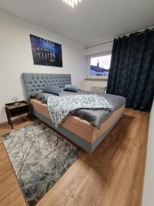Ένα ή περισσότερα κρεβάτια σε δωμάτιο στο Four Seasons Bodensee