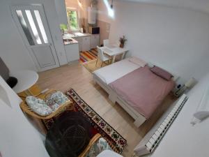 an overhead view of a bedroom with a bed and a bathroom at Apartman Medrese in Sarajevo
