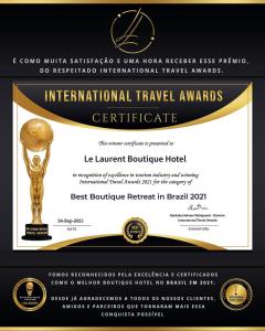 a certificate for an award with a trophy at Le Laurent Boutique Hotel - Adult Only in Arraial d'Ajuda