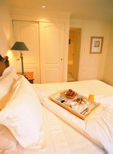 Cama ou camas em um quarto em Hotel Posada Los Alamos