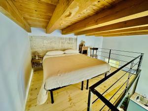 Postel nebo postele na pokoji v ubytování Palazzo Lupicini Affittacamere