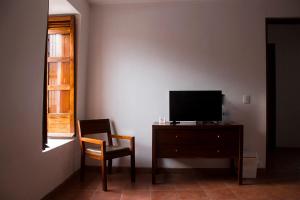TV a/nebo společenská místnost v ubytování Hotel Posada Santa Rita