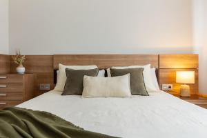 Llit o llits en una habitació de El Rincón del Condado by Asturias Holidays