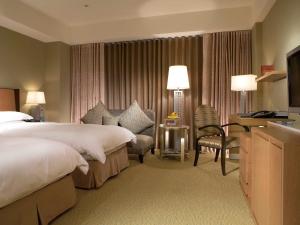 Кровать или кровати в номере City Suites-Taipei Nanxi
