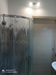 a shower with a glass door in a bathroom at La stella di Chanel in Nardò +23 photos