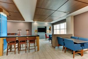 a dining room with a table and chairs at Holiday Inn Express Lake Worth NW Loop 820 by IHG in Fort Worth