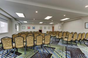 an empty room with a bunch of chairs in it at Holiday Inn Express Lake Worth NW Loop 820 by IHG in Fort Worth +35 photos