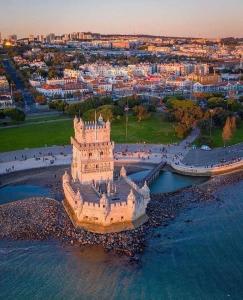 an aerial view of a castle in the water at Belém- Charming Apartments in Lisbon