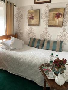 a bedroom with a bed and a table with a coffee table at Ryan's Daughter B&B in Thurles