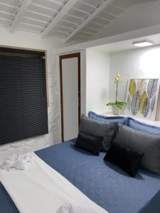Cama ou camas em um quarto em Oásis do Pontal do Atalaia