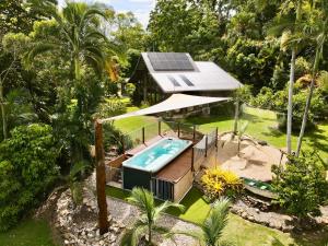 an overhead view of a house with a swimming pool at Butterfly Studio in Proserpine